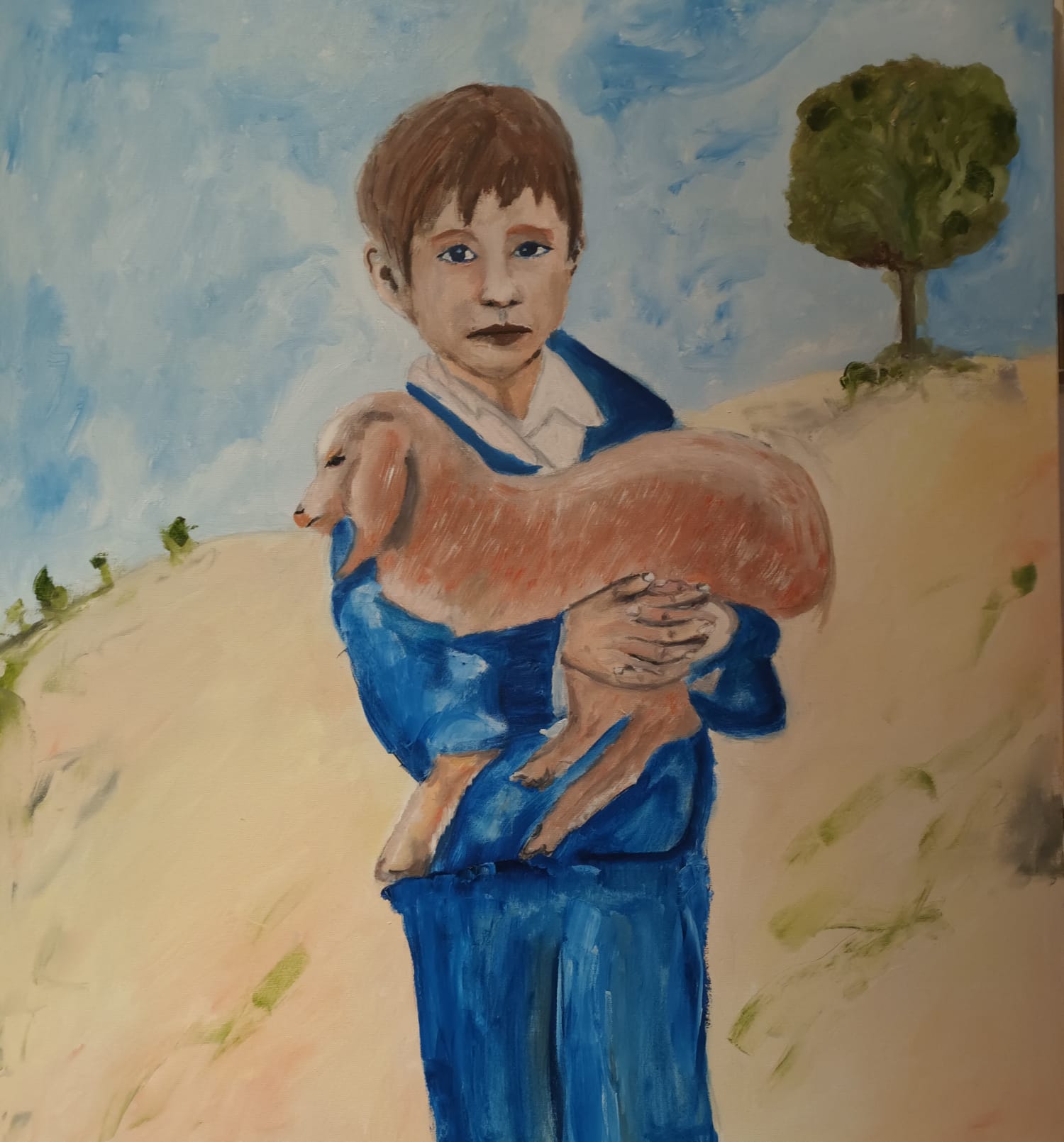 Enfant dans le desert avec son petit mouton